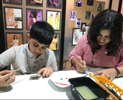 Mother and son are painting