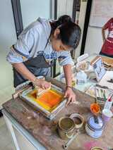 Hands-on with screen printing — turning design into art with every pull.